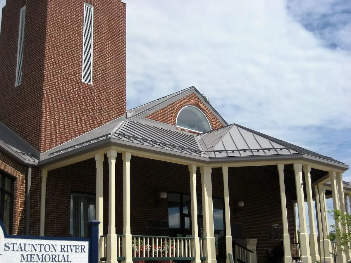 Skilled roofing craftsmen working on a residential roof in Hoover